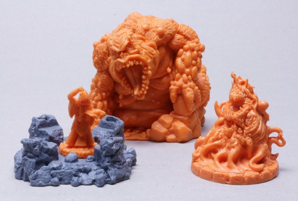 Basic types of models in Cthulhu Wars. From left to right, a generic Acolyte who is controlling a Gate (grey), then a Great Old One (Tsathoggua) and a Monster (Formless Spawn).