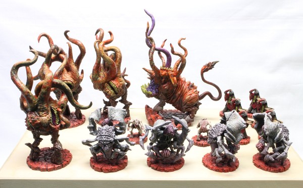 All of the faction’s models on top of their box, for comparison with the unpainted version.