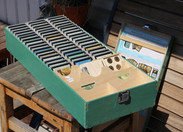 All the parts of the storage solution. Copper, randomizers, and a card-sized Trash mat go in the compartments up front, but are not shown here.