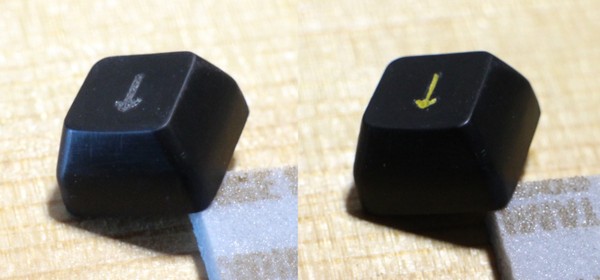 One arrow key, as produced by `dmote-keycap` v0.5.1, fully sanded to P2000 grit, before and after painting in the legend. This specific keycap is the same one that is shown in this image at an earlier stage.