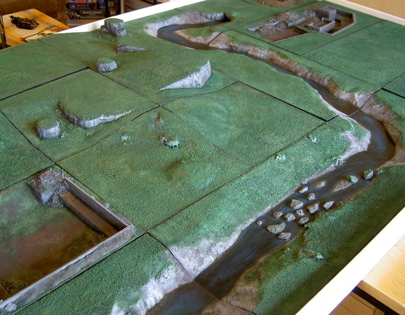 The first square-foot terrain modules, layed out on a board.