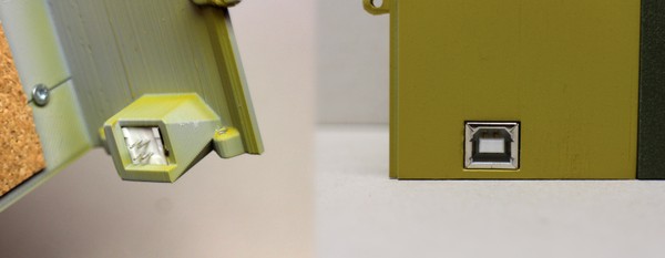 A composite image of a USB B port mounted in the rear wall of the right-hand-side bookend, from two angles.