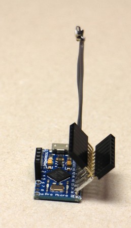 An example of how to prep an MCU board, in this case a Pro Micro, with a few headers and a tiny reset button on stalks.