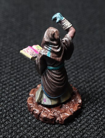 A Daemon Sultan Acolyte Cultist with sub-standard reading material.